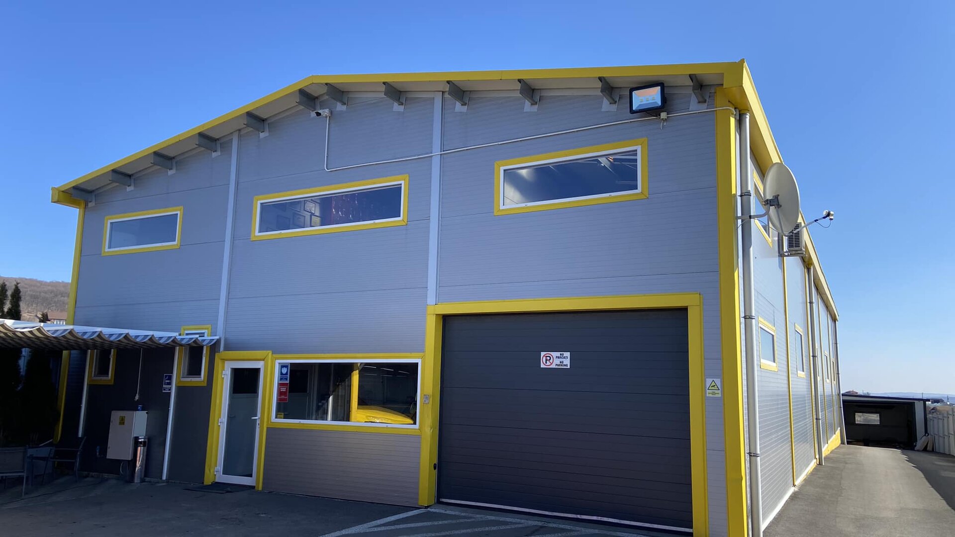 Service Adam - Clădire modernă cu accent galben Opel, Cluj-Napoca